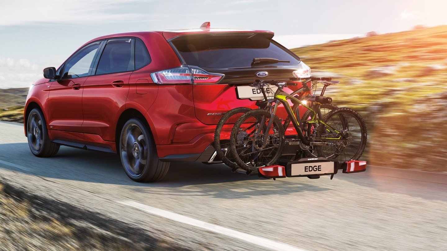 Red Ford Edge with rear bike carrier